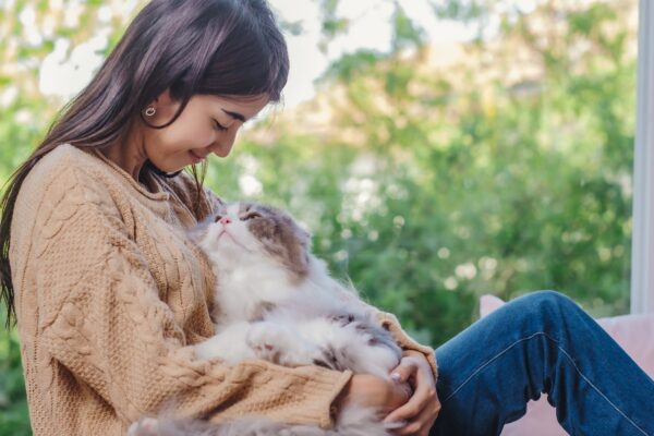 Girl and her fluffy cat